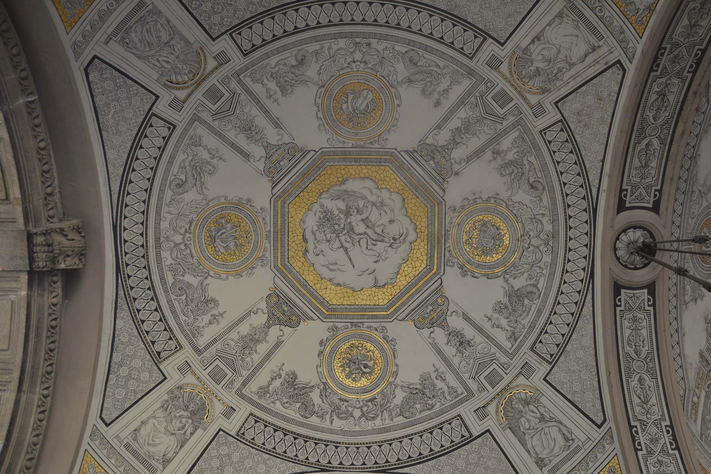 An original painted ceiling in grey and gold